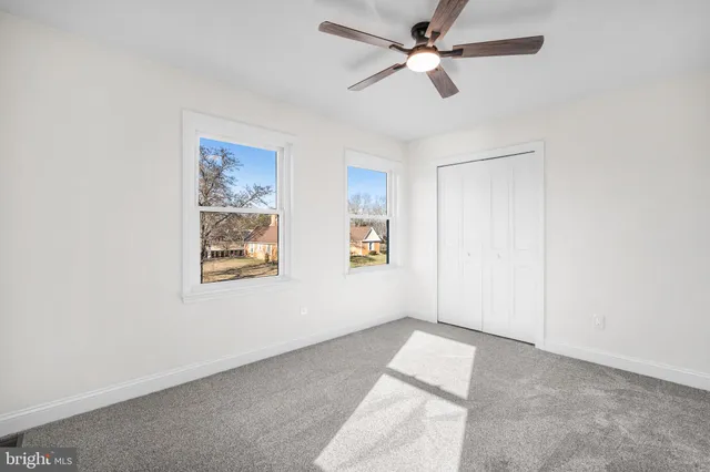 a view of a big room with carpet