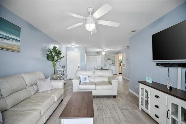 a living room with furniture and a flat screen tv