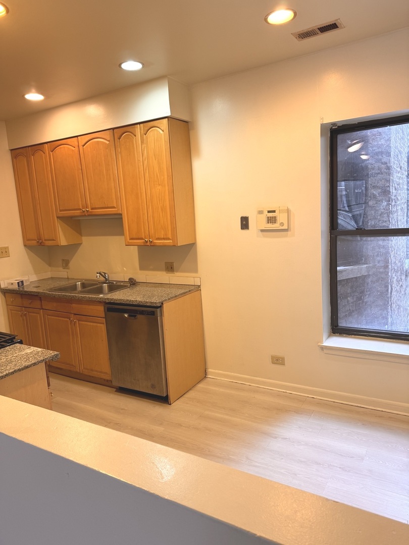 4615 South Michigan Avenue, Unit 2S Chicago, IL 60653 - Photo 8 of 26 a view of a kitchen with a window