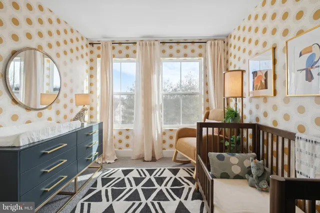 a bathroom with a sink mirror and a shower