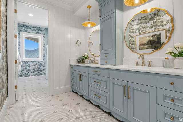 115 East Hidden Ridge Lane, Unit 42 Mapleton, UT 84664 - Photo 46 of 103 Double vanity featuring light blue cabinetry, gold-finish hardware, and a white countertop