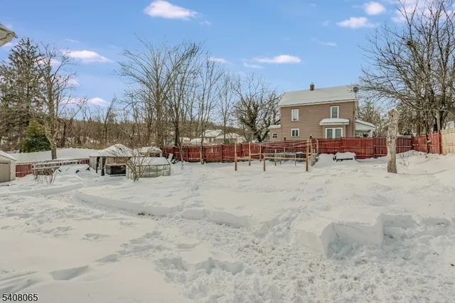 a view of a yard with a bench