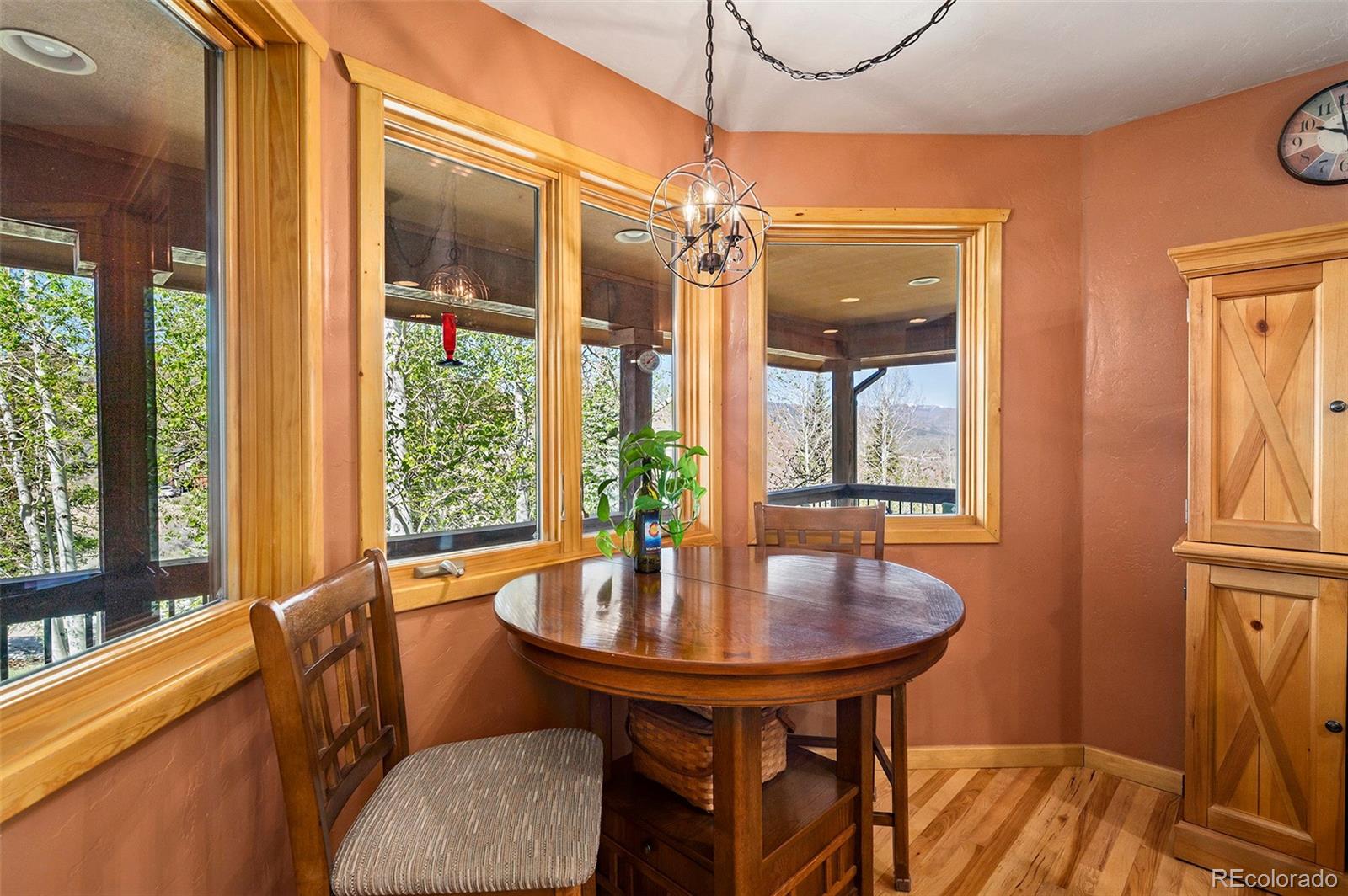 290 Village Road Granby, CO 80446 - Photo 12 of 45 a view of a dining room with furniture window and outside view