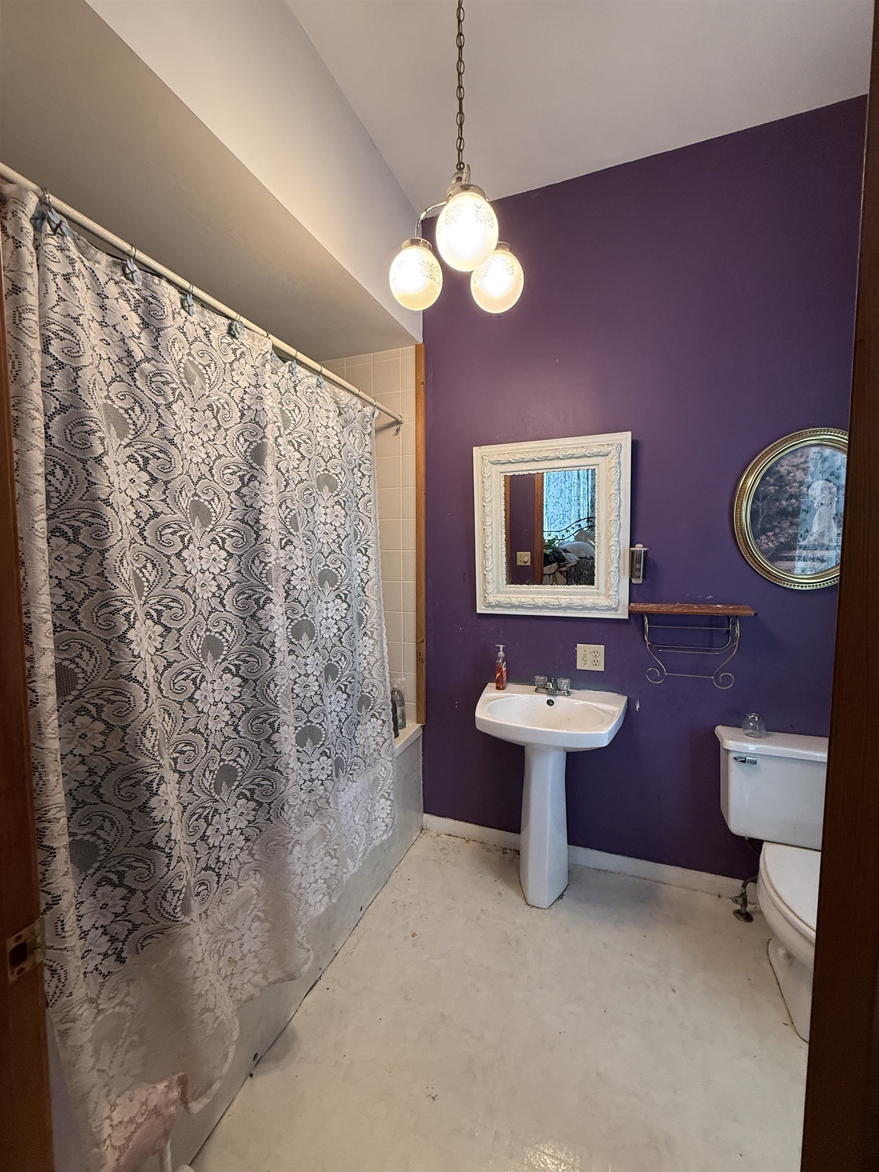 323 South Main Street Stockton, IL 61085 - Photo 22 of 32 a bathroom with a toilet sink and mirror