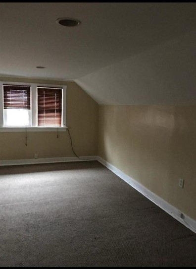422 South Street, Unit 2 Elgin, IL 60123 - Photo 2 of 6 a view of an empty room with a window