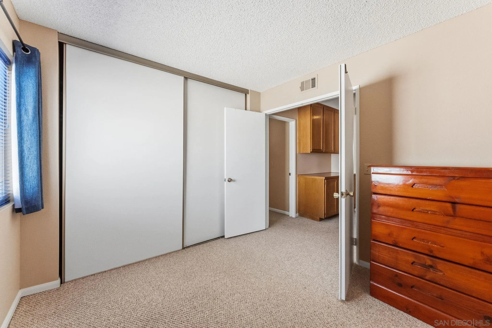 10565 Strathmore Drive Santee, CA 92071 - Photo 38 of 59 a view of an empty room with window and closet