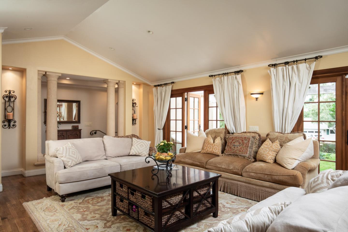 2869 Coyote Road Pebble Beach, CA 93953 - Photo 16 of 35 a living room with furniture and a large window