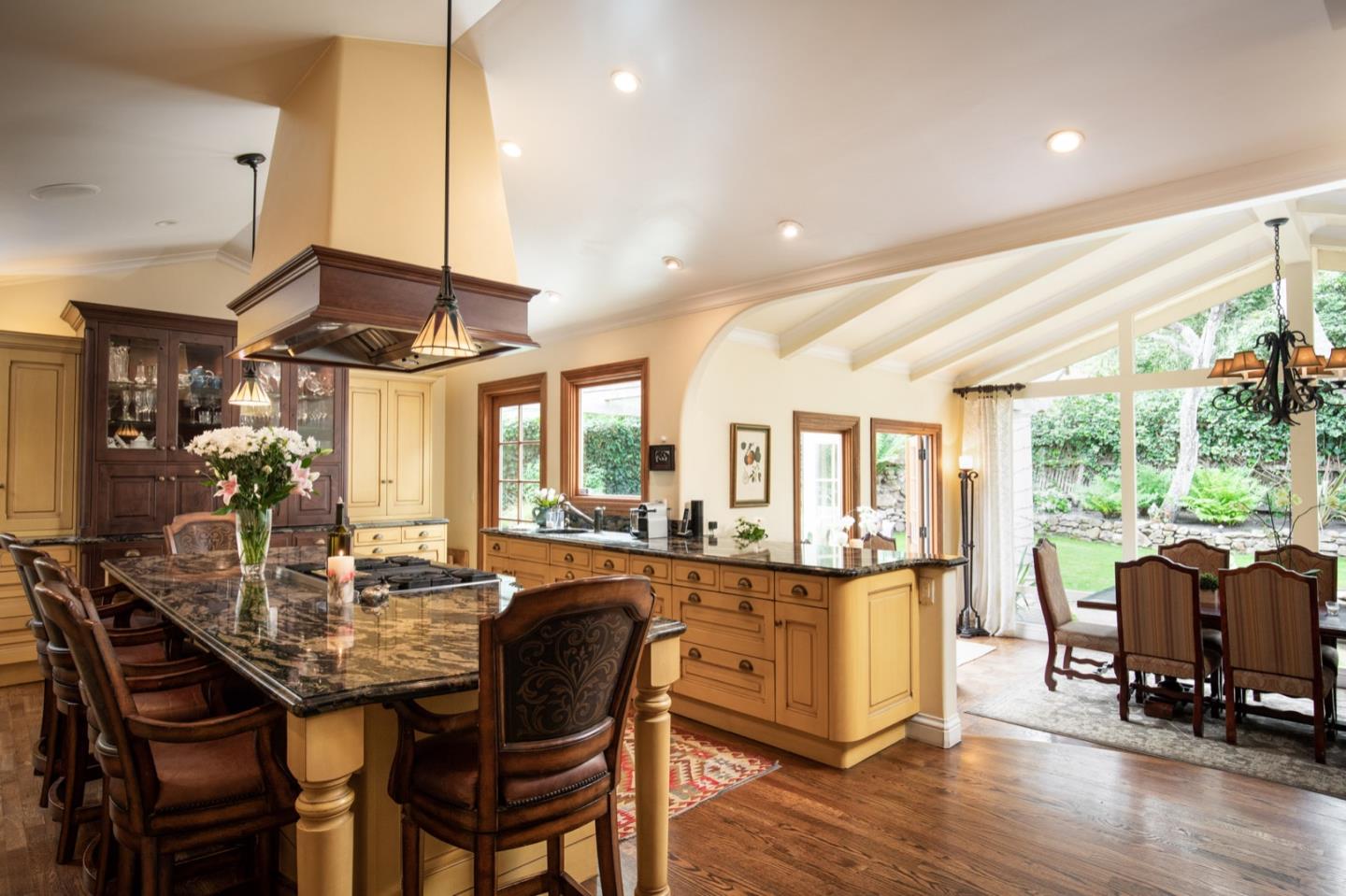 2869 Coyote Road Pebble Beach, CA 93953 - Photo 20 of 35 a dining room with furniture and wooden floor