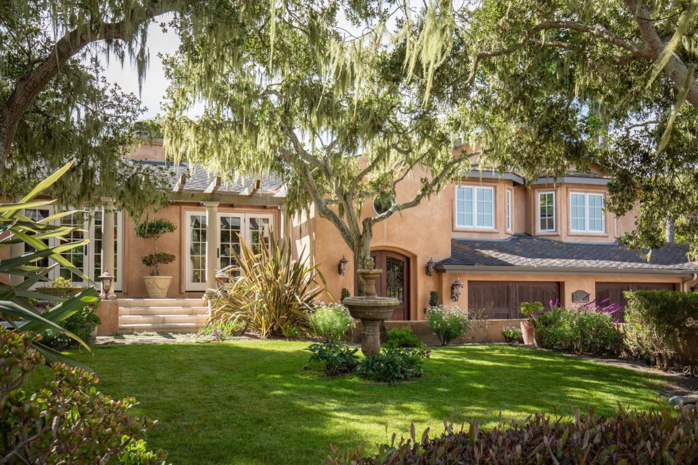 2869 Coyote Road Pebble Beach, CA 93953 - Photo 2 of 35 a front view of a house with a yard