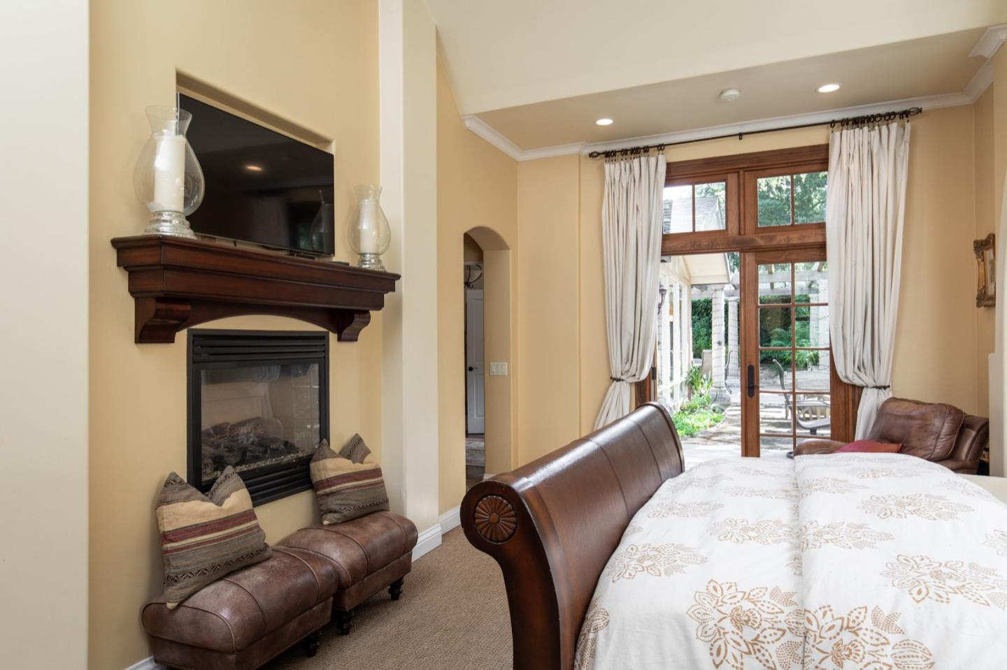 2869 Coyote Road Pebble Beach, CA 93953 - Photo 25 of 35 a bedroom with a bed and a television