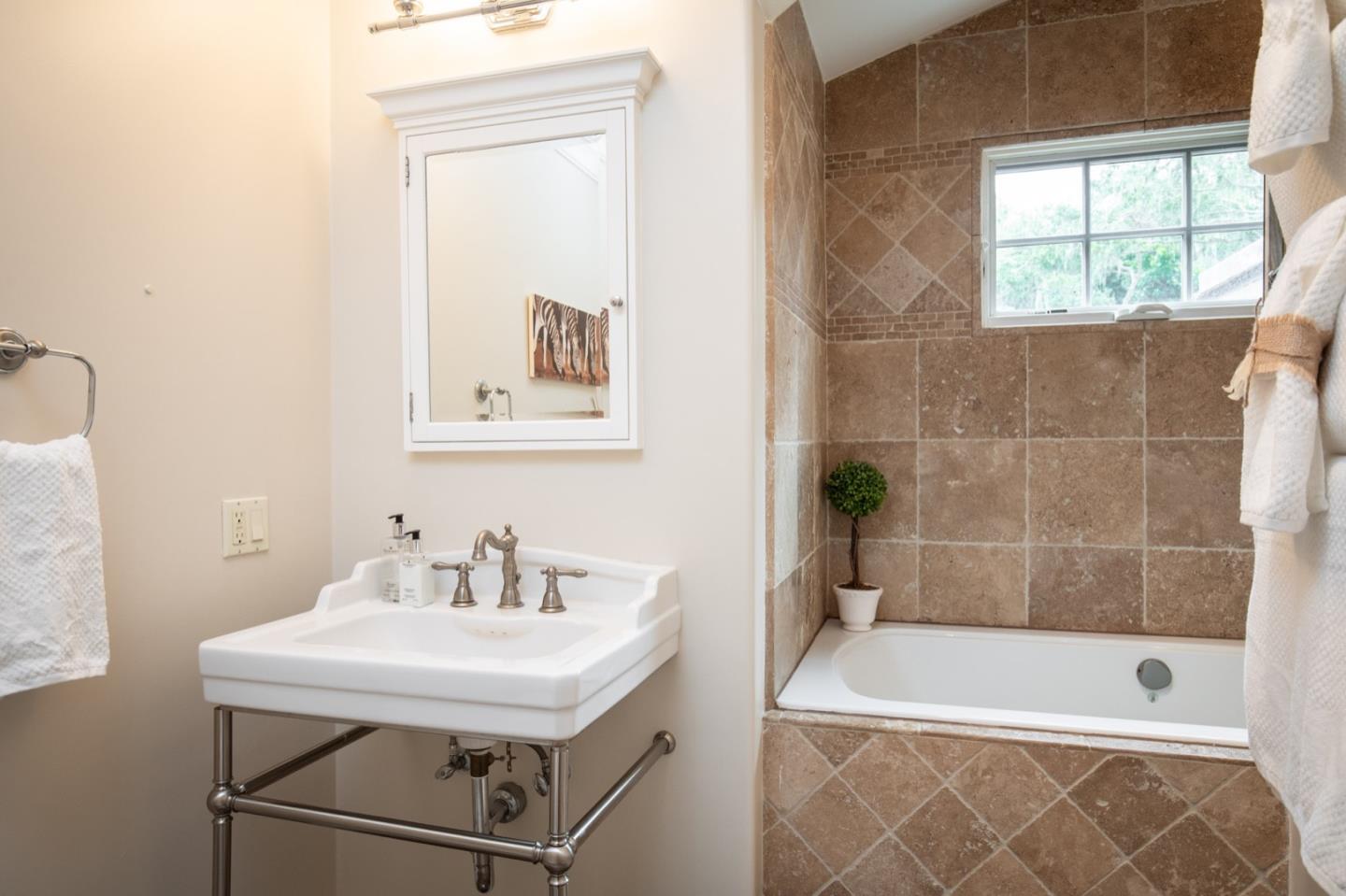 2869 Coyote Road Pebble Beach, CA 93953 - Photo 28 of 35 a bathroom with a sink a bathtub and a shower