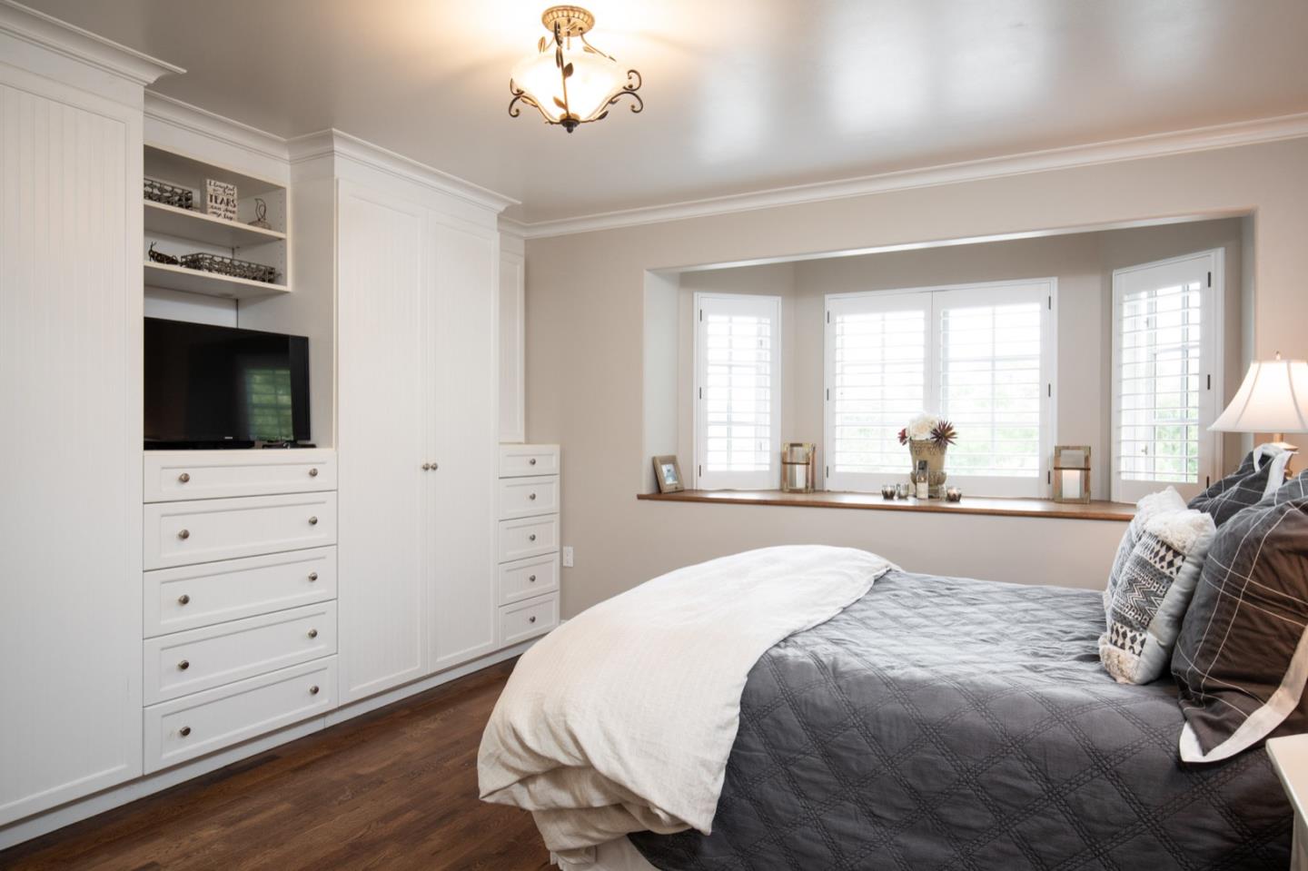 2869 Coyote Road Pebble Beach, CA 93953 - Photo 29 of 35 a spacious bedroom with a bed and a flat screen tv