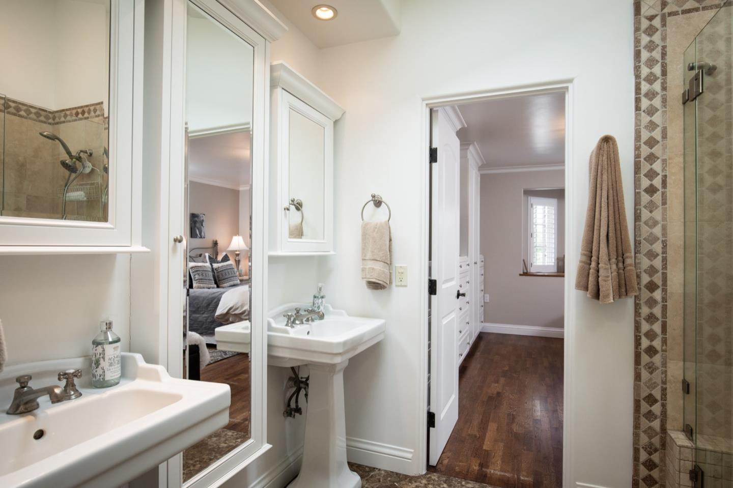 2869 Coyote Road Pebble Beach, CA 93953 - Photo 30 of 35 a bathroom with a sink and a mirror