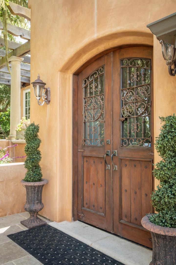 2869 Coyote Road Pebble Beach, CA 93953 - Photo 8 of 35 a front view of a house with a yard