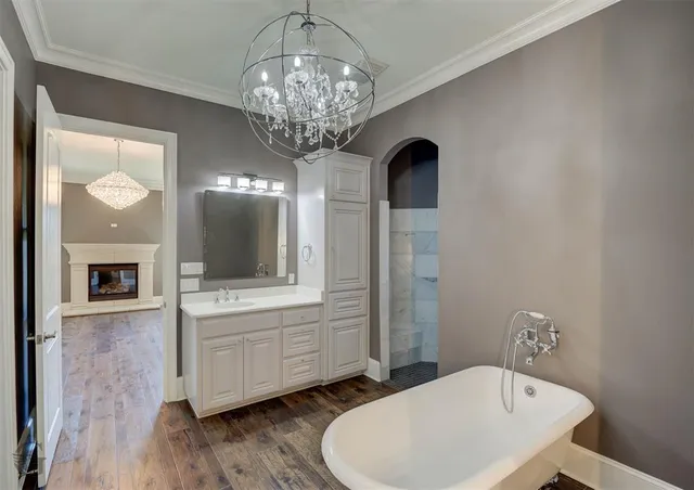 a bathroom with a sink and a large mirror