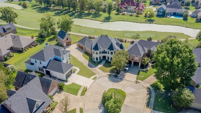 an aerial view of residential house with outdoor space and swimming pool