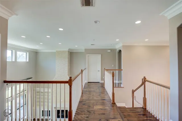 a view of a kitchen with a sink cabinets and wooden floor