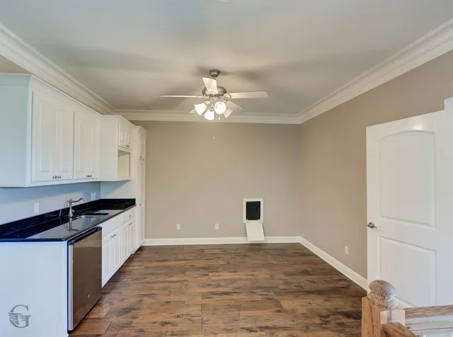 a bathroom with a window and a ceiling fan