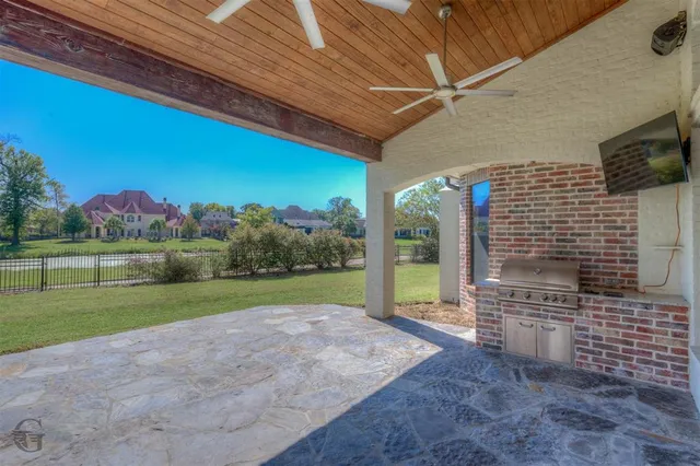 a view of a backyard with plants and outdoor seating