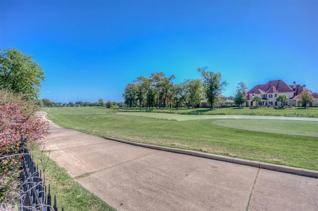 a view of a golf course with a lake