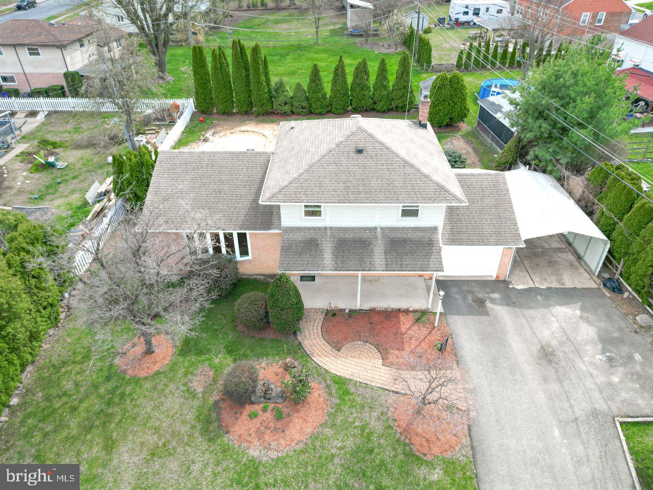 a aerial view of a house with a yard