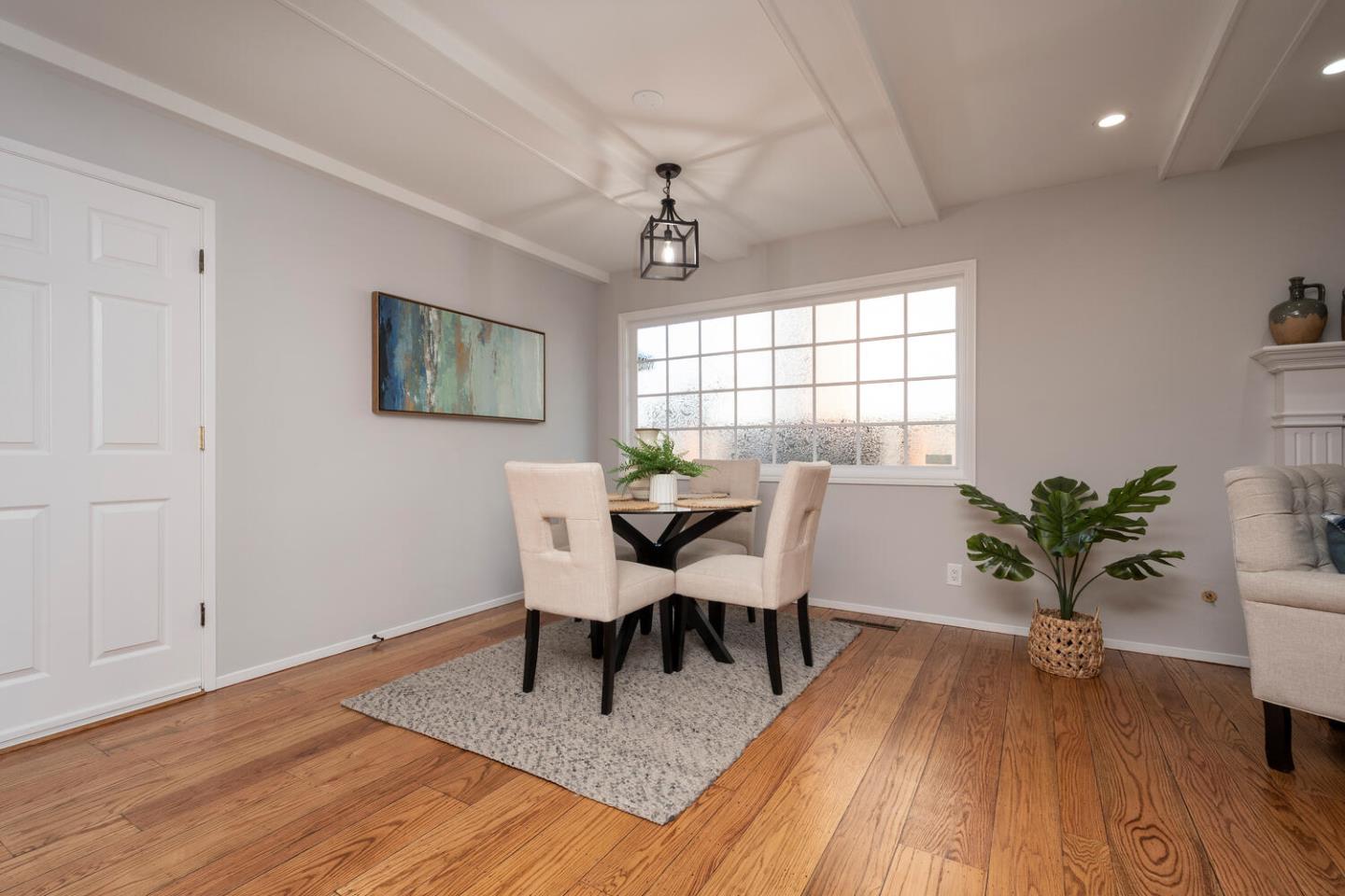 3115 Rivera Drive Burlingame, CA 94010 - Photo 12 of 26 a view of a dining room with furniture window and wooden floor