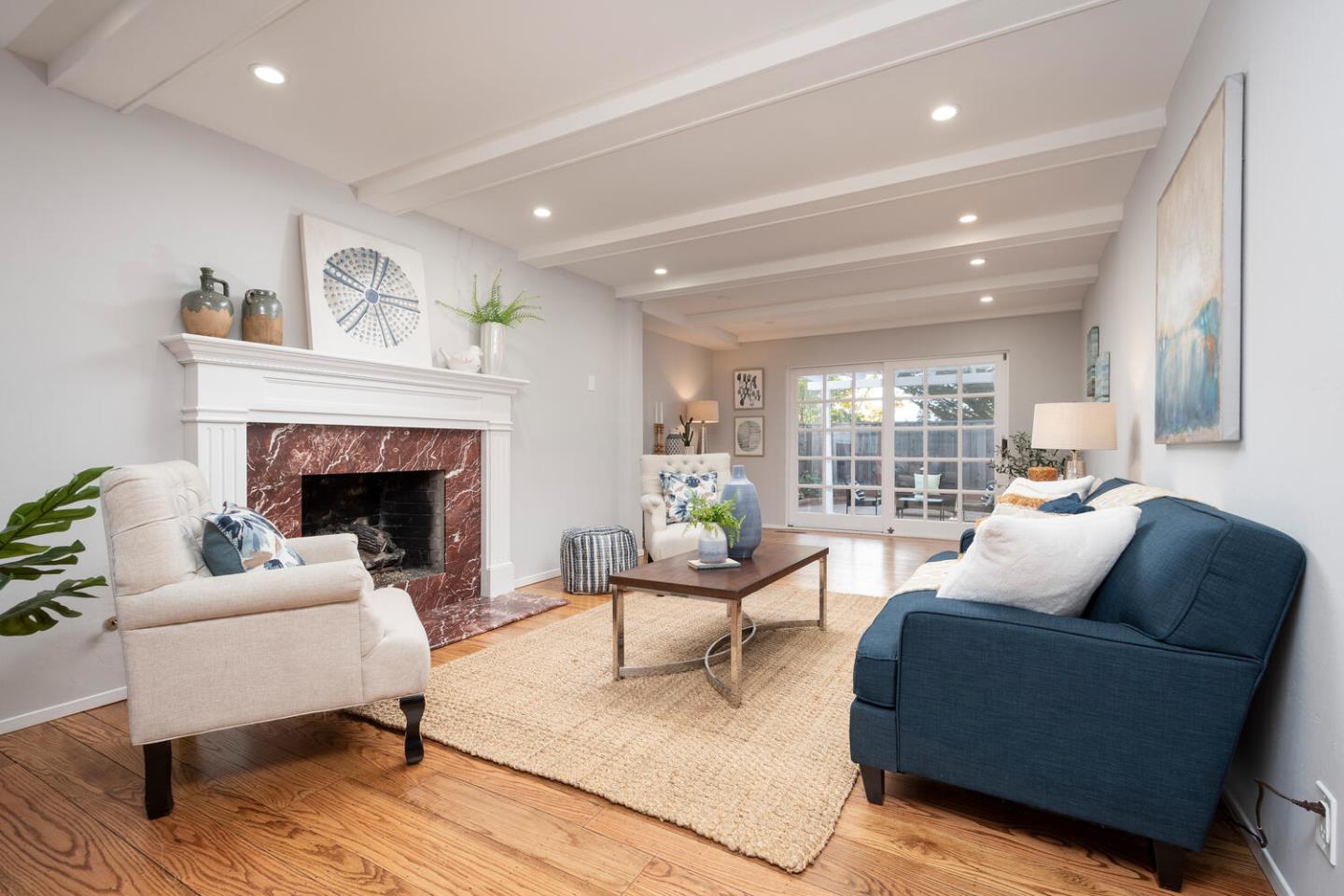 3115 Rivera Drive Burlingame, CA 94010 - Photo 13 of 26 a living room with furniture and a fireplace