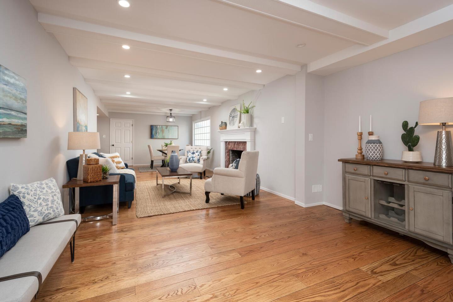 3115 Rivera Drive Burlingame, CA 94010 - Photo 14 of 26 a living room with furniture and a fireplace