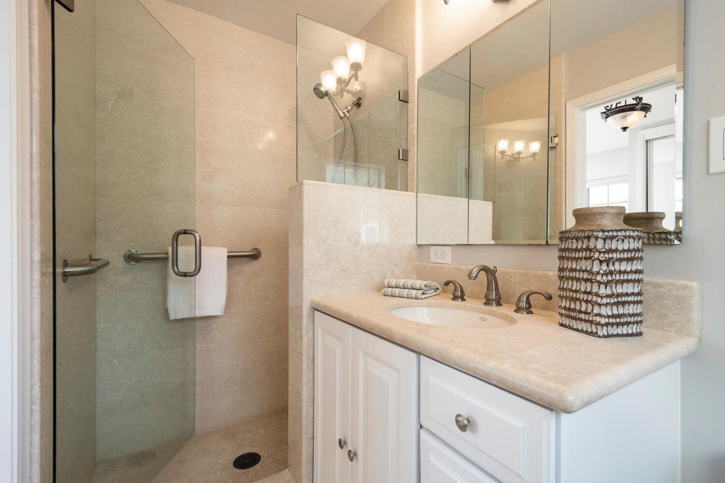 3115 Rivera Drive Burlingame, CA 94010 - Photo 17 of 26 a bathroom with a sink and a mirror