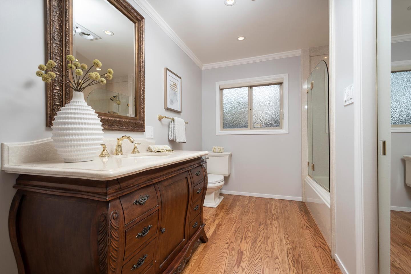 3115 Rivera Drive Burlingame, CA 94010 - Photo 19 of 26 a bathroom with a sink and a mirror