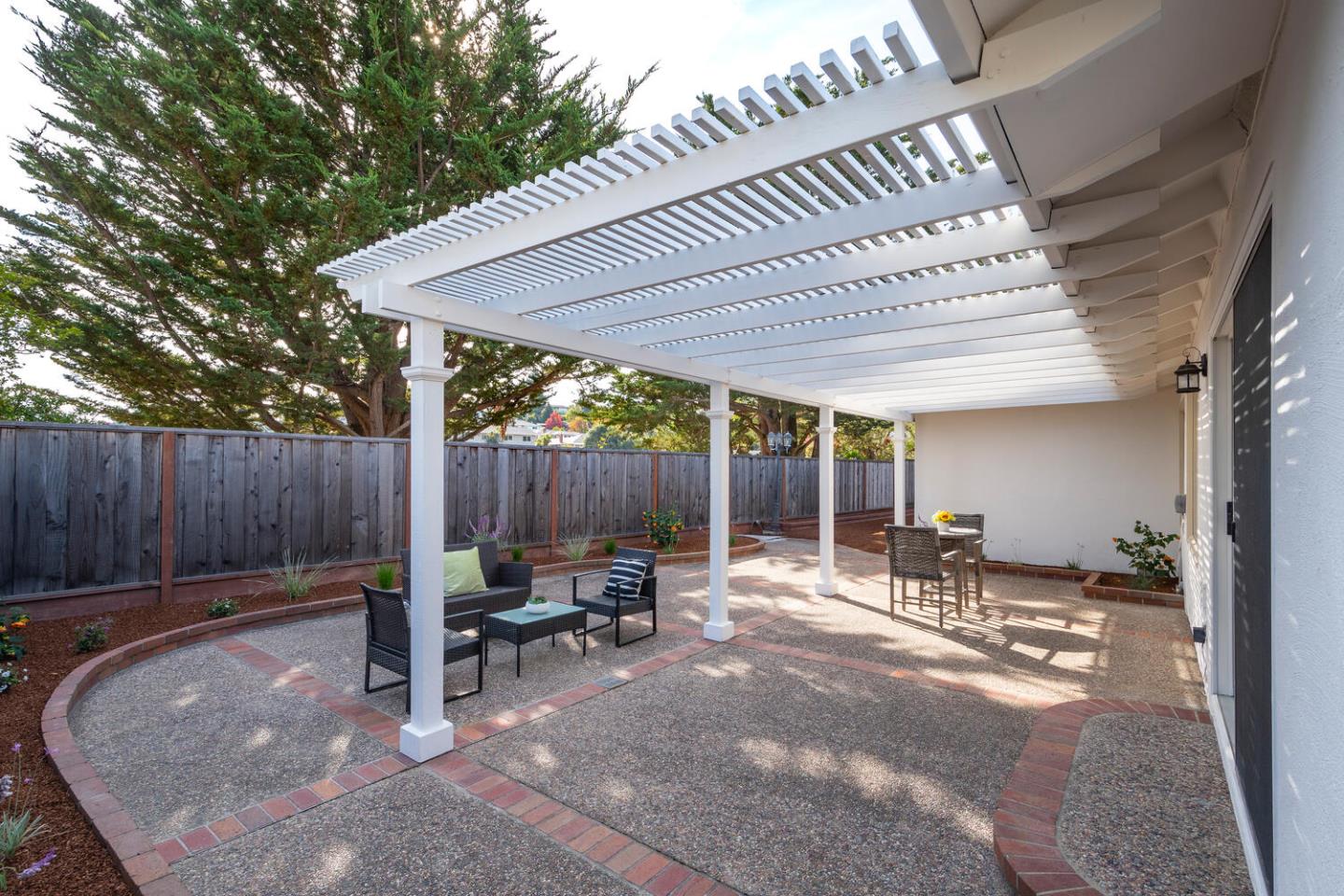 3115 Rivera Drive Burlingame, CA 94010 - Photo 24 of 26 a patio with table and chairs and potted plants