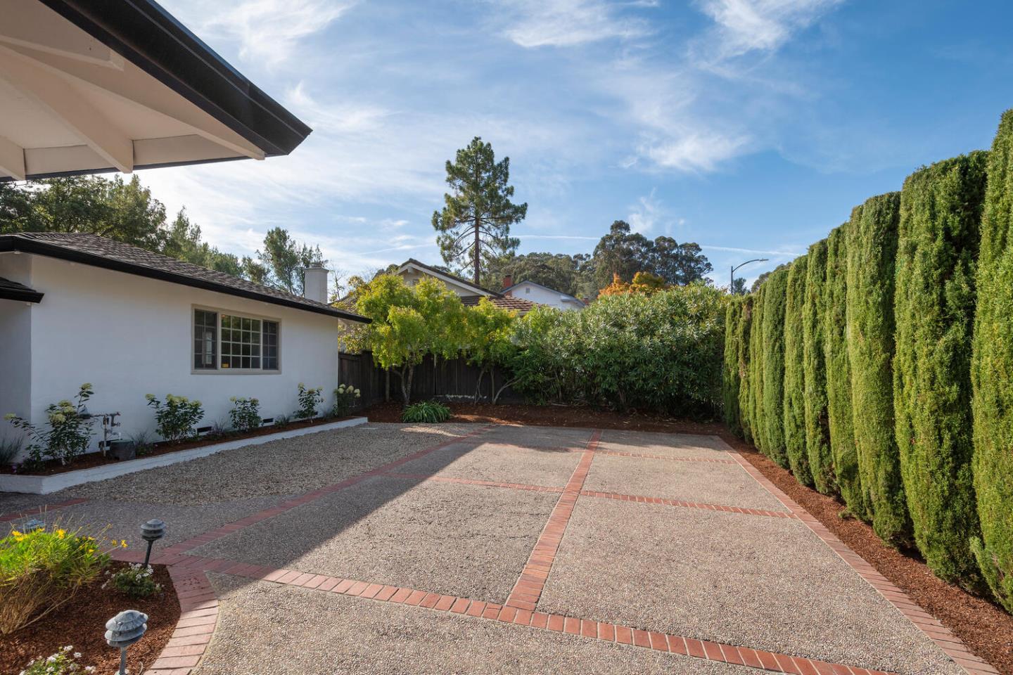 3115 Rivera Drive Burlingame, CA 94010 - Photo 4 of 26 a view of a house with a yard and potted plants