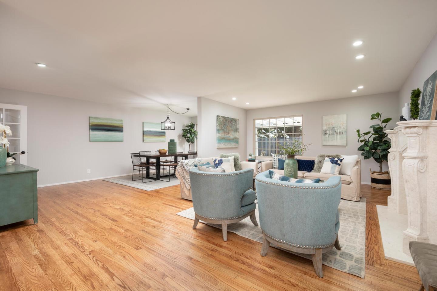 3115 Rivera Drive Burlingame, CA 94010 - Photo 7 of 26 a living room with furniture a dining table and a potted plant
