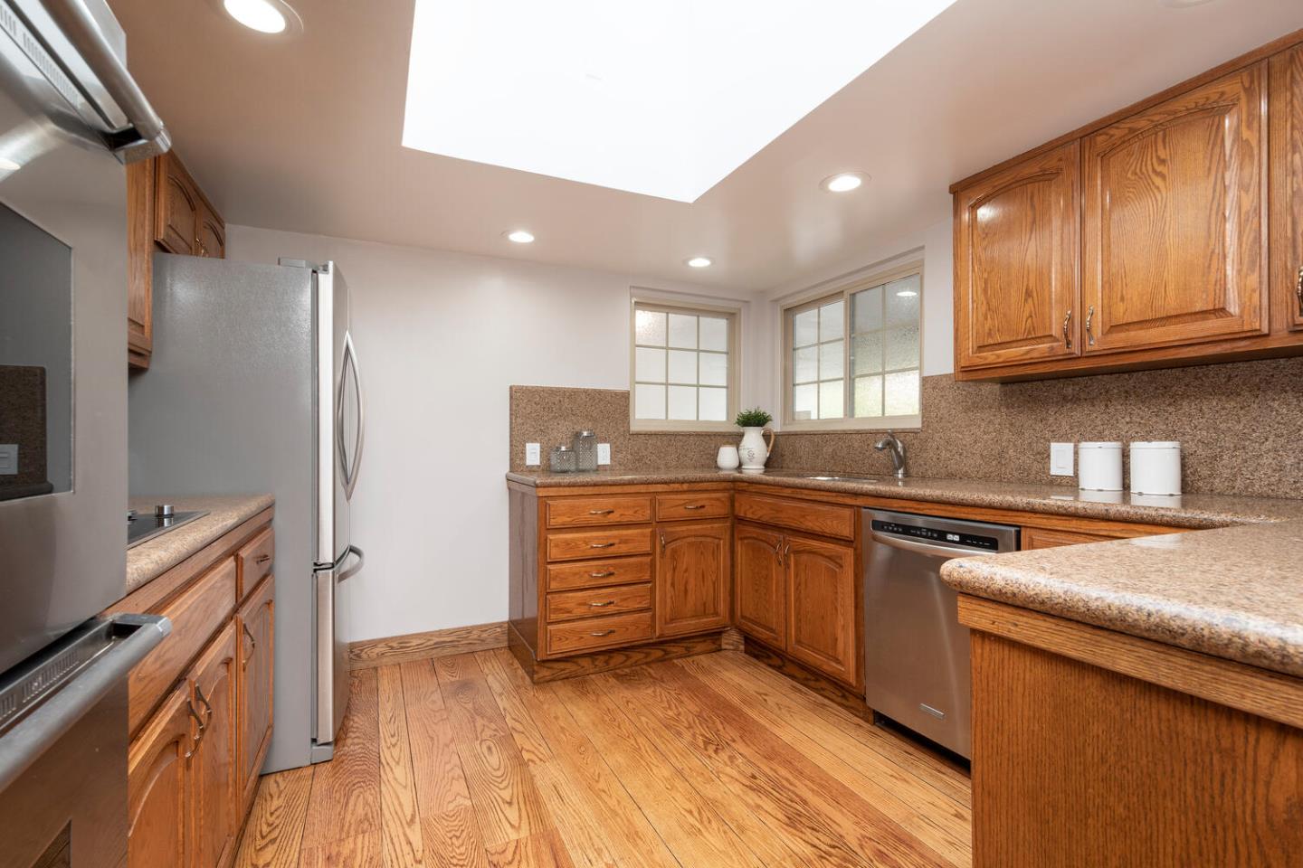 3115 Rivera Drive Burlingame, CA 94010 - Photo 10 of 26 a kitchen with granite countertop a refrigerator stove top oven and sink