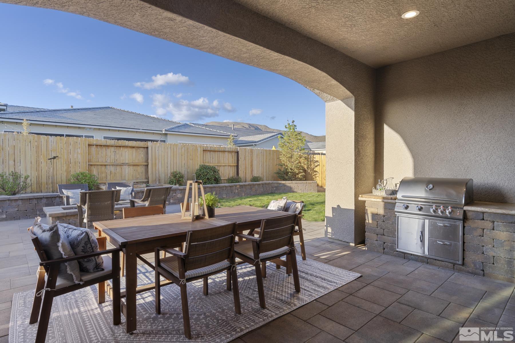2329 Blushing Rock Drive Reno, NV 89521 - Photo 16 of 40 a view of a dining room with furniture window and outside view