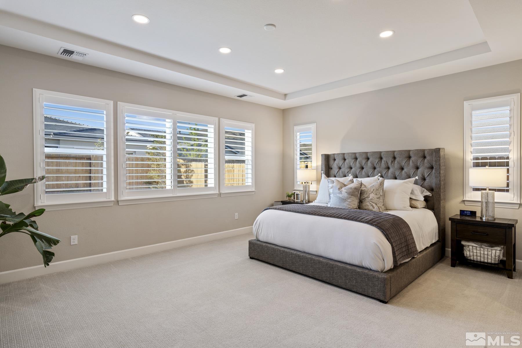 2329 Blushing Rock Drive Reno, NV 89521 - Photo 19 of 40 a spacious bedroom with a bed and a large window