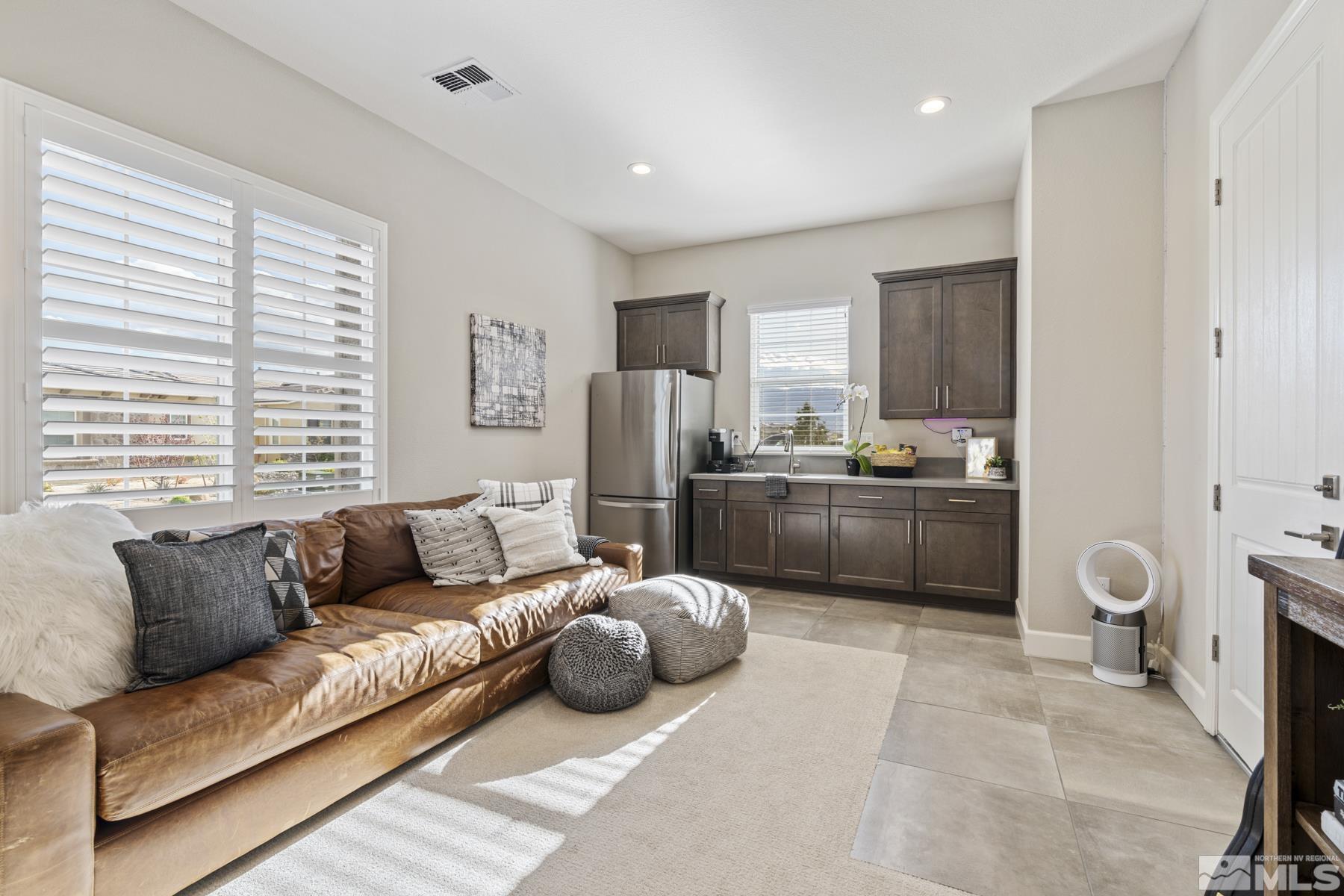 2329 Blushing Rock Drive Reno, NV 89521 - Photo 27 of 40 a living room with furniture a couch and a window