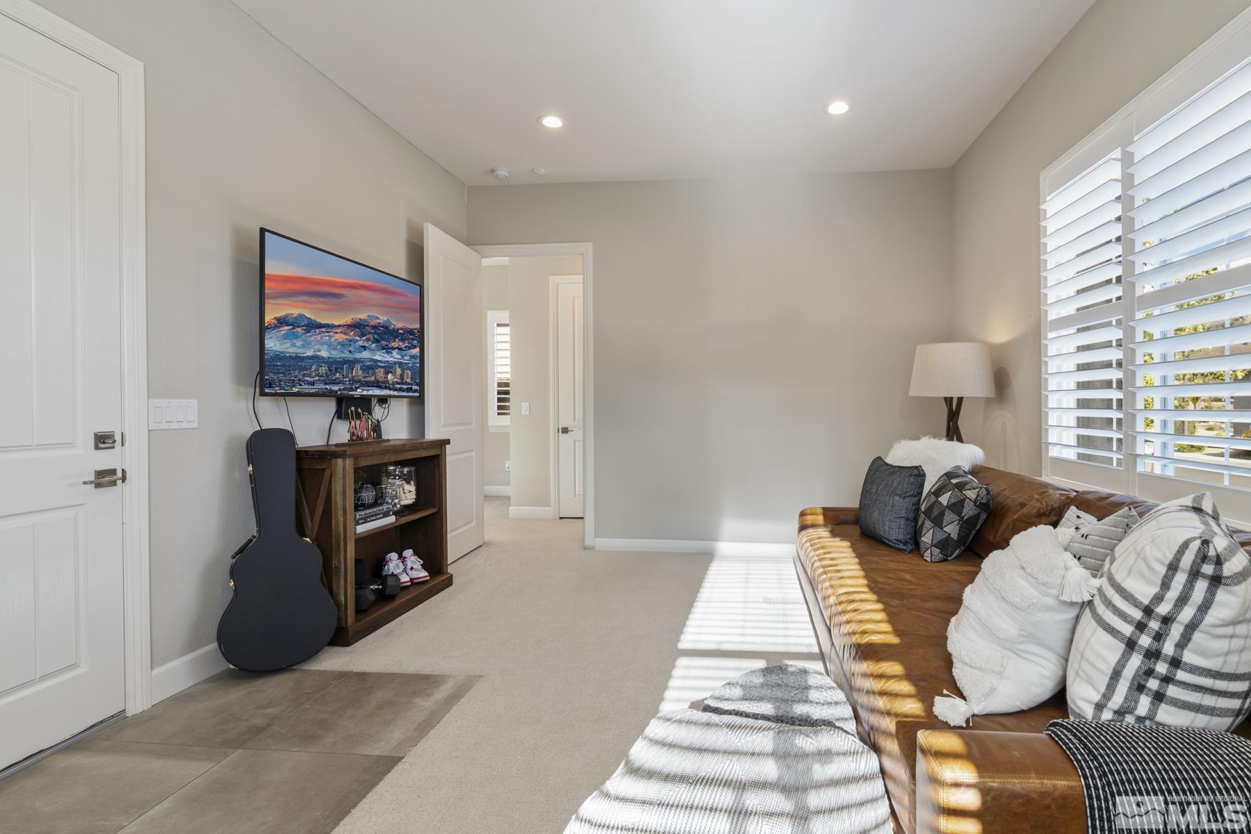 2329 Blushing Rock Drive Reno, NV 89521 - Photo 28 of 40 a bed room with a bed and a television