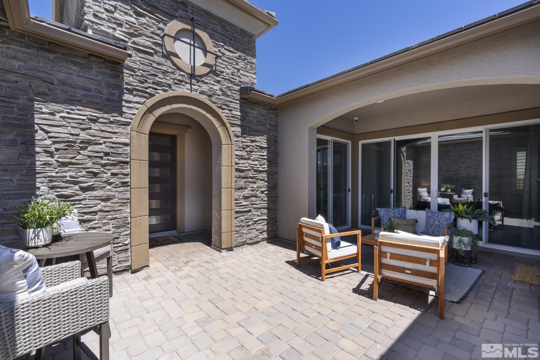 2329 Blushing Rock Drive Reno, NV 89521 - Photo 3 of 40 a outdoor living space with furniture and a potted plant
