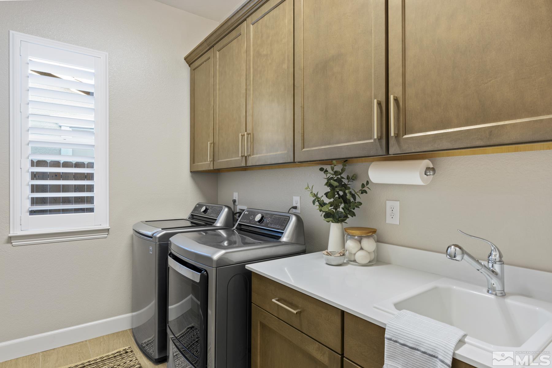 2329 Blushing Rock Drive Reno, NV 89521 - Photo 33 of 40 a utility room with sink dryer and washer
