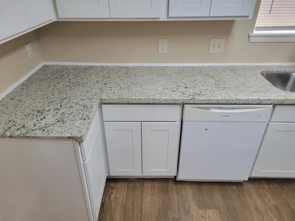 a view of room with wooden floor