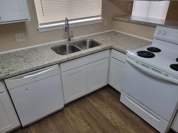 a kitchen with appliances and cabinets