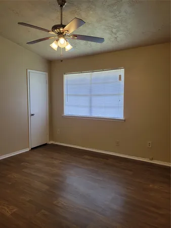 a bathroom with a granite countertop sink and mirror