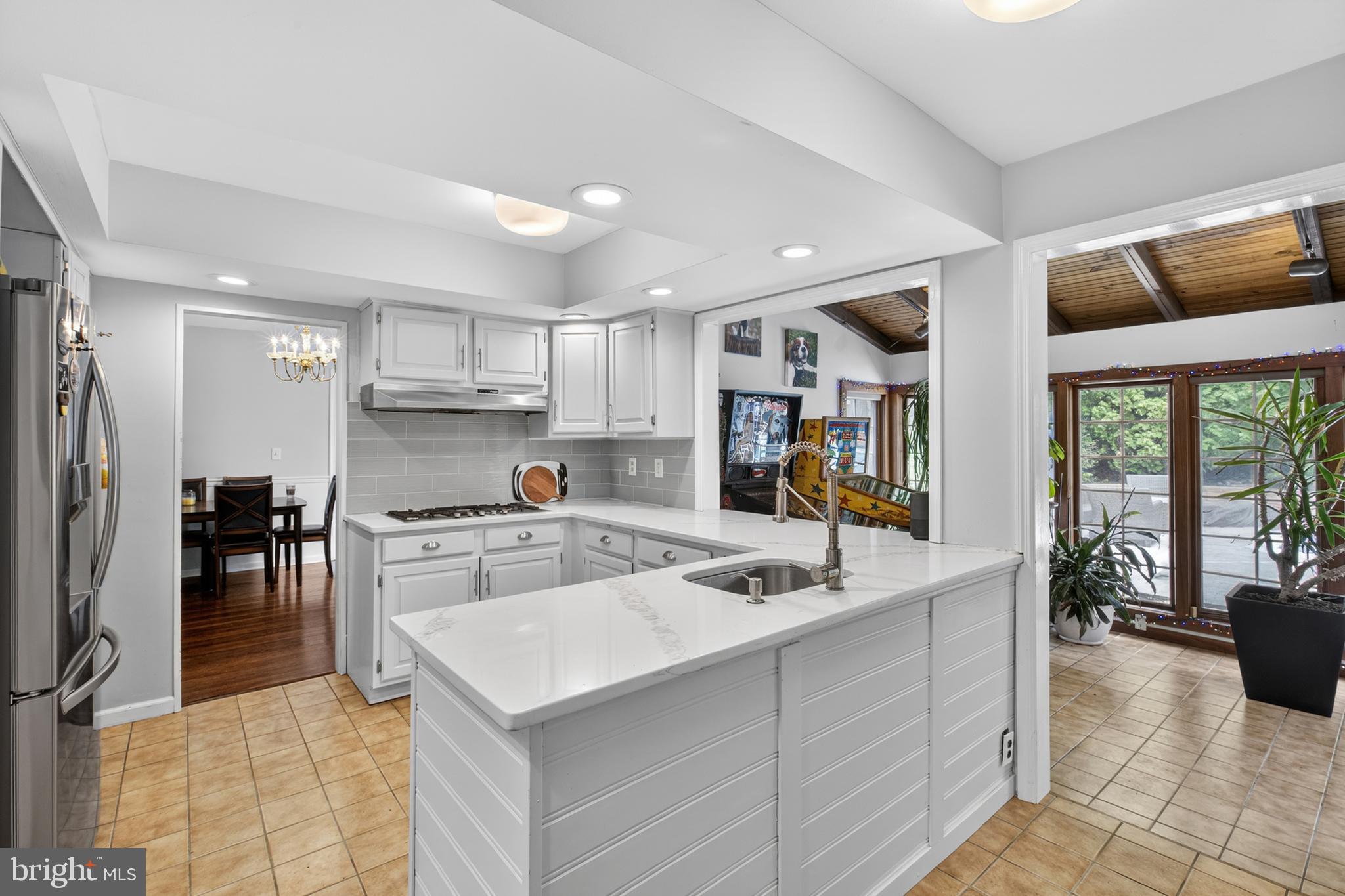 216 Revere Road Marlton, NJ 08053 - Photo 9 of 47 a kitchen with stainless steel appliances kitchen island granite countertop a sink and cabinets