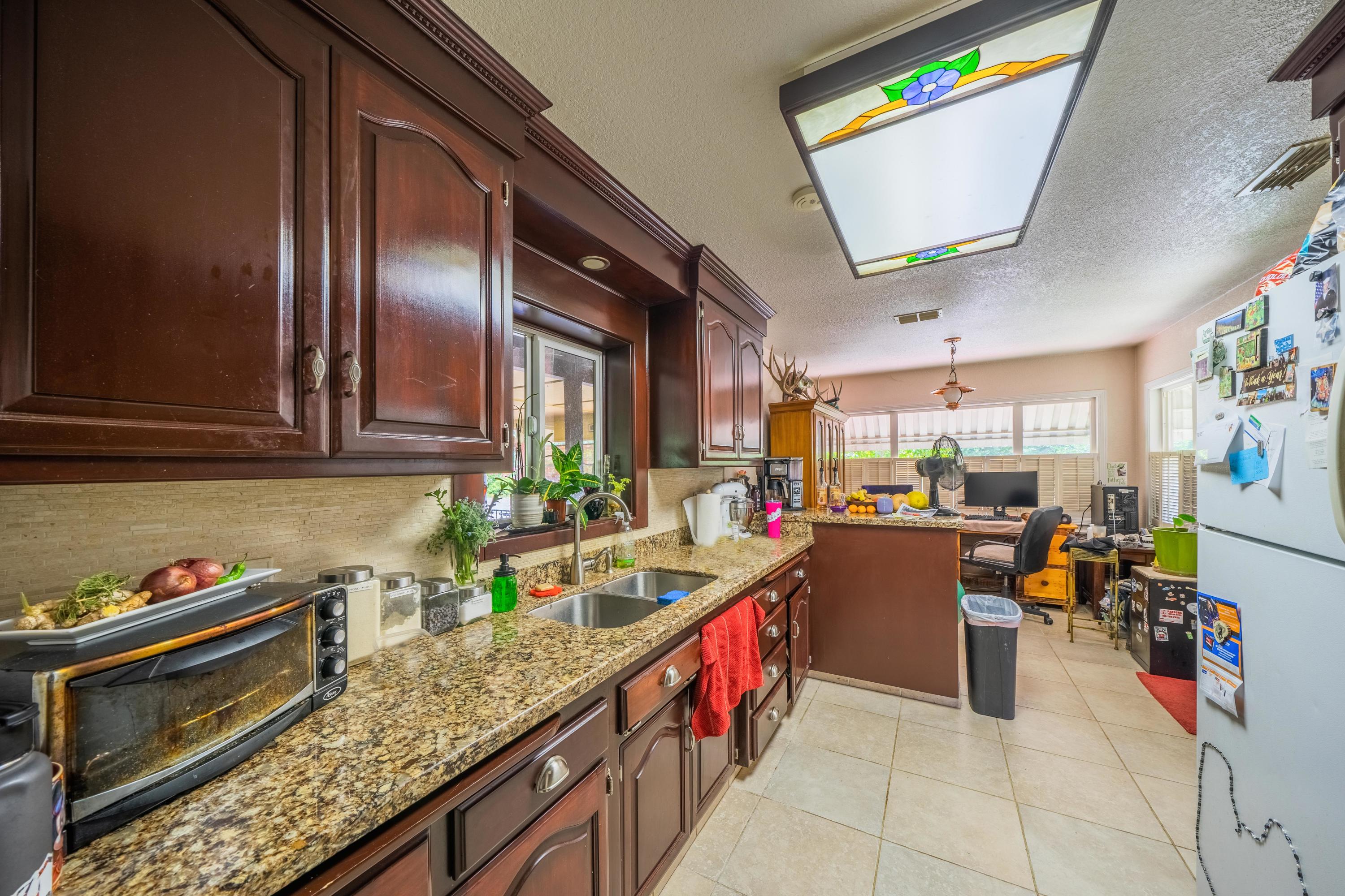 1542 Old Alturas Road Redding, CA 96003 - Photo 8 of 20 a kitchen with granite countertop lots of counter top space