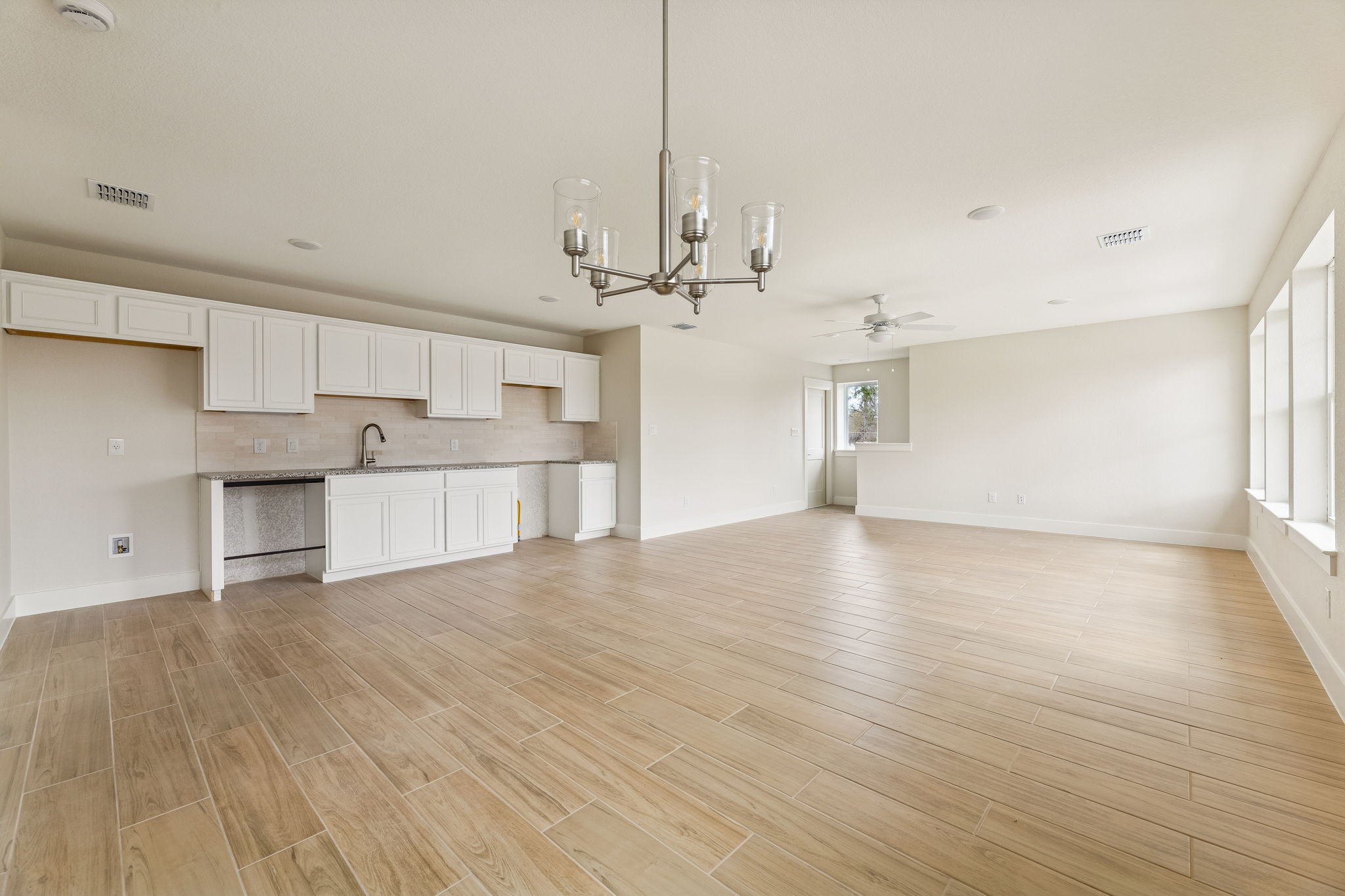 1412 Kent Street Taylor, TX 76574 - Photo 11 of 12 Guest Quarters - view from dining room overlooking the living room and kitchen.
