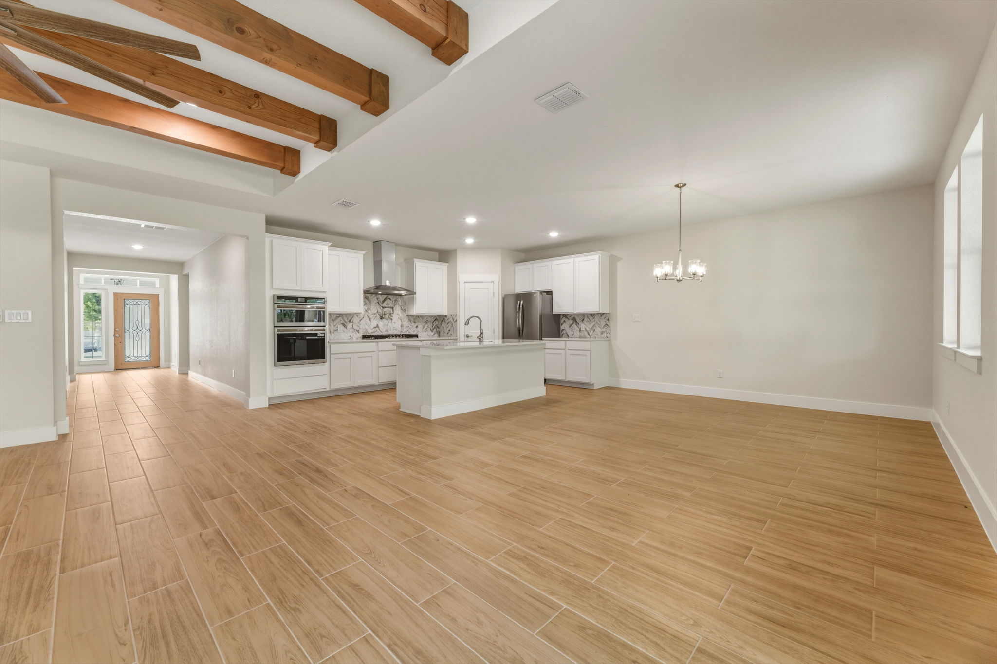 1412 Kent Street Taylor, TX 76574 - Photo 14 of 40 a view of kitchen with wooden floor