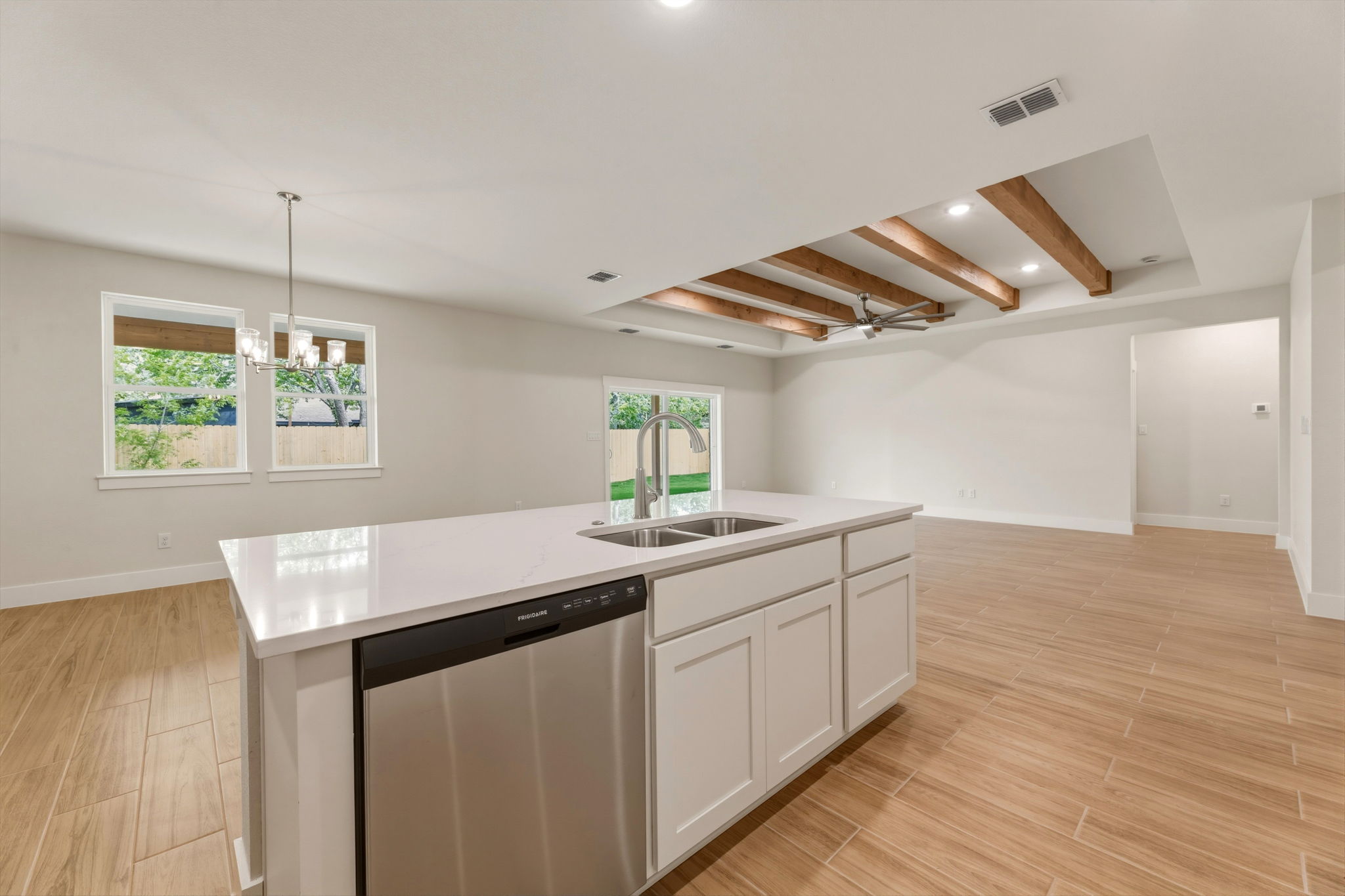 1412 Kent Street Taylor, TX 76574 - Photo 19 of 40 a kitchen with a sink and wooden floor