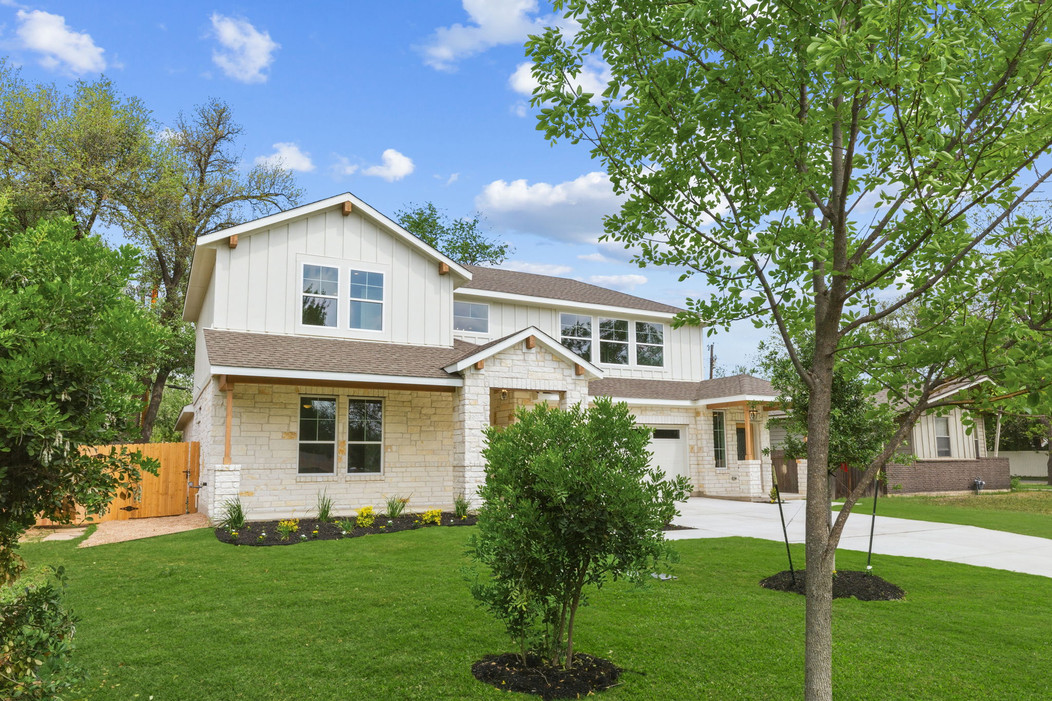 1412 Kent Street Taylor, TX 76574 - Photo 2 of 40 a front view of a house with a garden