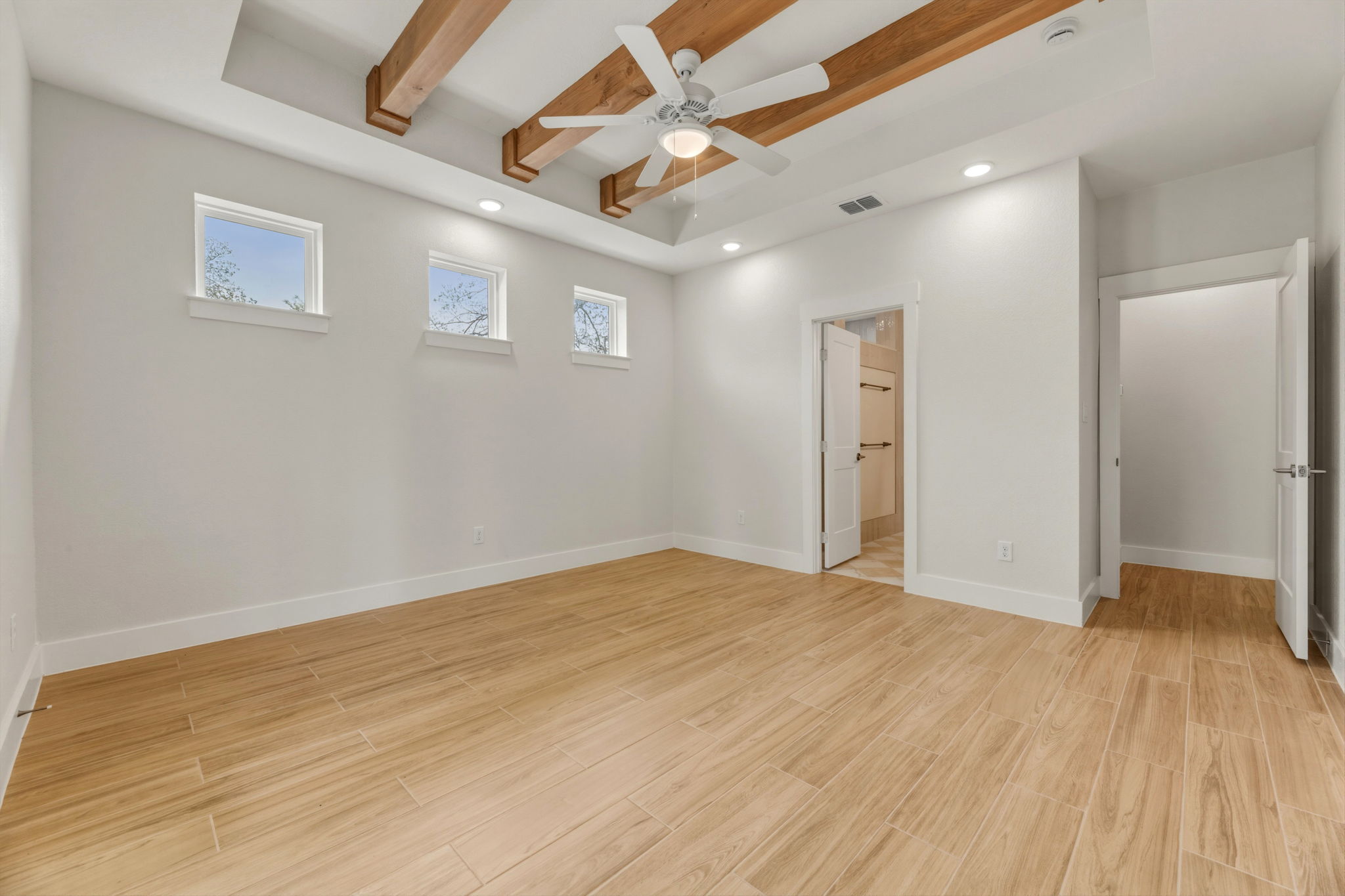 1412 Kent Street Taylor, TX 76574 - Photo 21 of 40 a view of an empty room with wooden floor